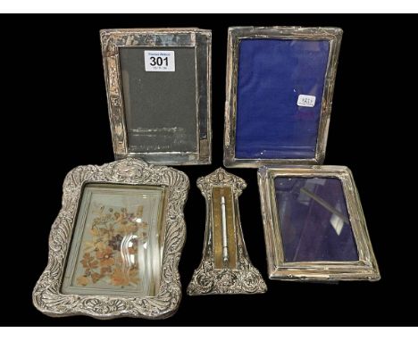 Silver mounted thermometer and four silver mounted photograph frames (5).