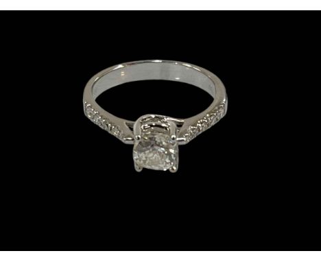 18 carat white gold 70 point centre diamond ring set with five graduated diamonds to each shoulder, size M.