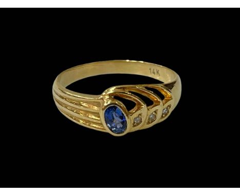 14 carat yellow gold Ceylon sapphire and three stone diamond ring, size Q.