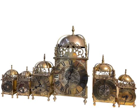 Six brass lantern clocks.