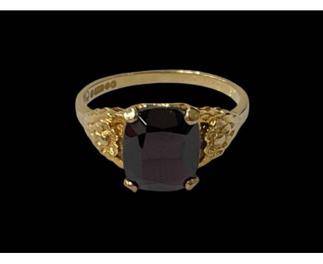 9 carat yellow gold and single stone garnet ring.