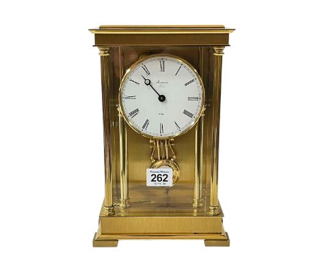 Rapport brass four pillar mantel clock with enamel dial.