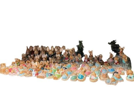 Collection of Pendelfin figures including stands.