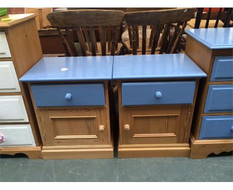 Two pine bedside cabinets, each with one draw over a cupboard, the drawer and top painted a light blue