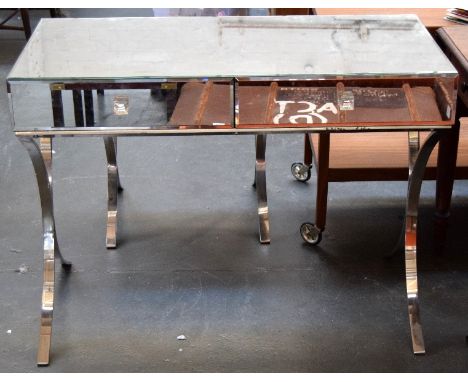 An original Barcelona console table, with mirrored top, sides, back and front, two drawers with glass handles, on two chromiu