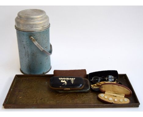 A vintage thermos flask, brass tray, and several vintage spectacles in leather cases