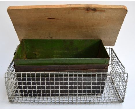 Four vintage industrial metal storage drawers and a galvanised basket with wooden lid