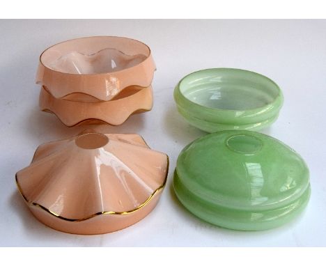 A set of three mid-century pink glass and gilt octagonal lightshades, 22cmD, and two pale green glass mid-century light shade