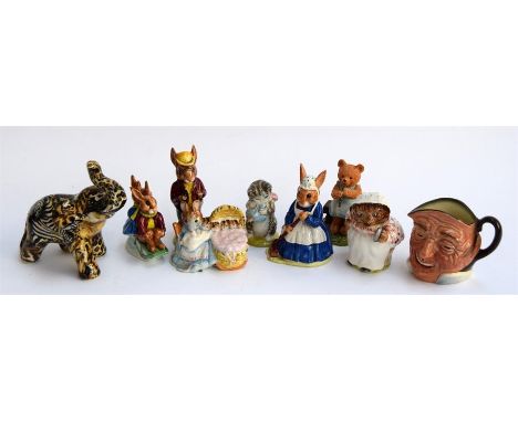 A number of Royal Doulton figurines to include Mrs Bunnykins 'Clean Sweep', Billy and Bunty Bunnykins 'Sleigh Ride', Mr Bunny