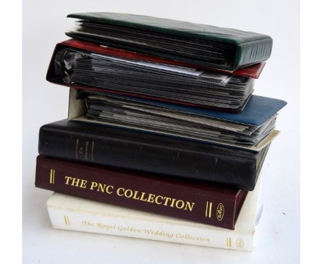 A large quantity of first day covers and commemorative proof coins