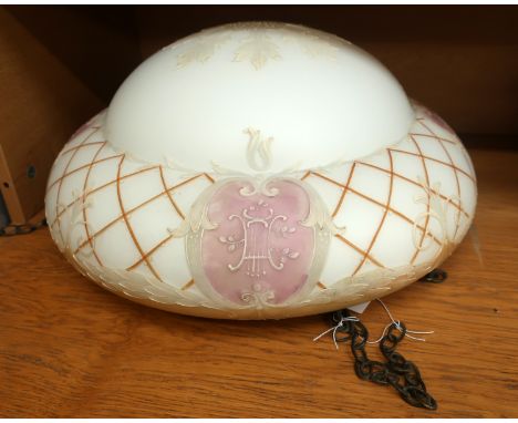 A late 19th century glass hanging light shade with decoration in relief.45cm diameter approx