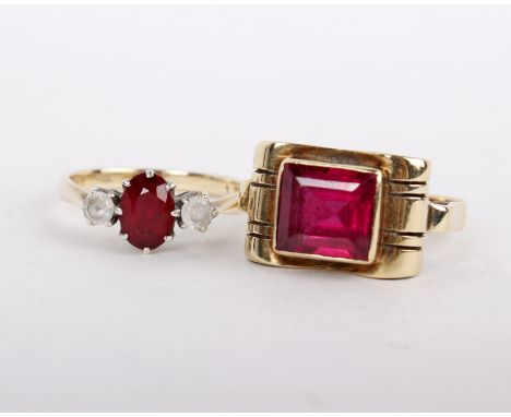 A synthetic ruby ring, the square cut synthetic ruby between scrolled shoulders, stamped with continental marks, ring size O;