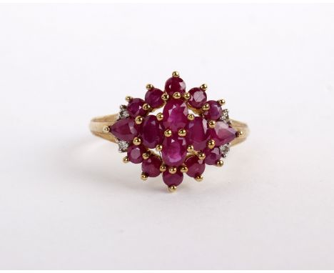 A 9ct gold ruby ring set with a cluster of various cut rubies, stamped 375 with Birmingham hallmark, size N, 3.1g