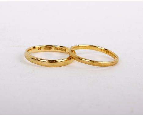A 22ct plain polished band gold ring, stamped 22 with full Birmingham hallmarks, size N; and a further 22ct gold ring, r size