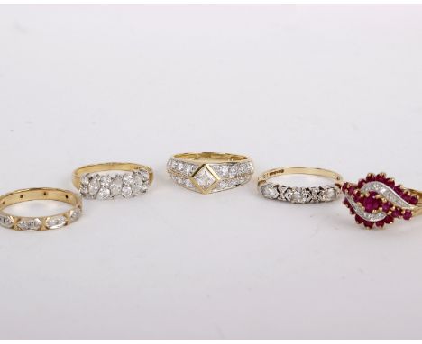 A 9ct gold ruby and diamond ring, set with an oval cut ruby between circular cut rubies and with eight cut diamond accents, s