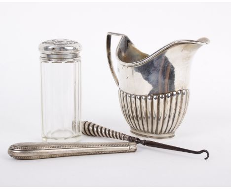 Sterling silver milk jug a silver topped pepperette and silver topped glass item