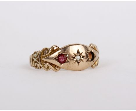 A 9ct gold ring, set with a diamond and a circular cut ruby, stamped 375 with Chester hallmarks, size N 1/2, 1.6g