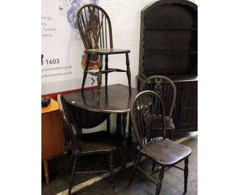 A Five Piece Oak Dining SuiteIncluding a gate leg table and four spindle back dining chairsTable:H74 x W131(extended), 35(lea