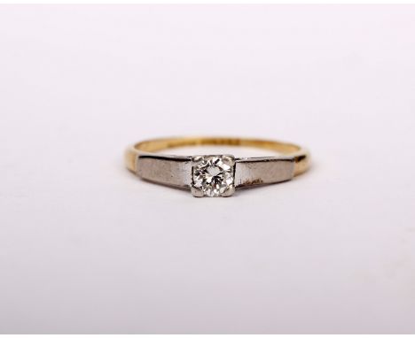 An 18ct gold and platinum single stone diamond ring. Central brilliant cut diamond in four claw setting. 2g. size K.