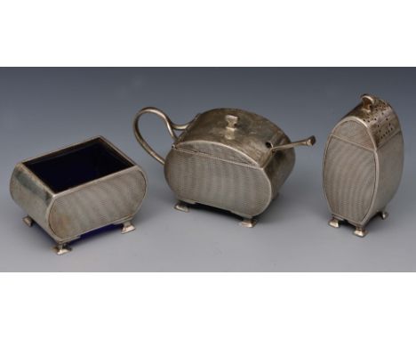 Art Deco style silver three piece condiment set of stylised baluster form with engine turned decoration and ogee supports, Bi