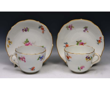 Pair of Meissen white ground small cups and saucers