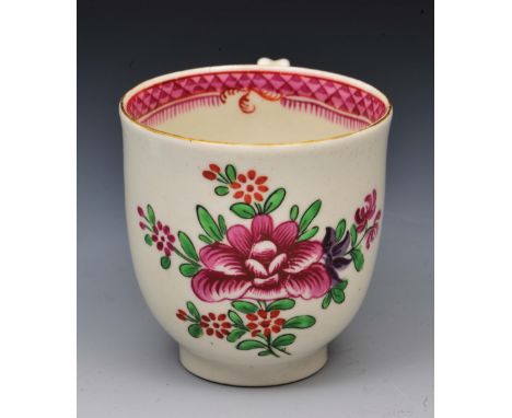 Worcester coffee cup circa 1770, decorated in polychrome enamels with Oriental flowers, 6cm high