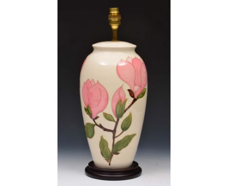 Moorcroft Magnolia lamp base on a white ground with pink flowers, 32cm high