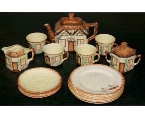 Cottage Ware part tea set including a teapot, a sugar basin and a milk jug, four cups and saucers and six side plates