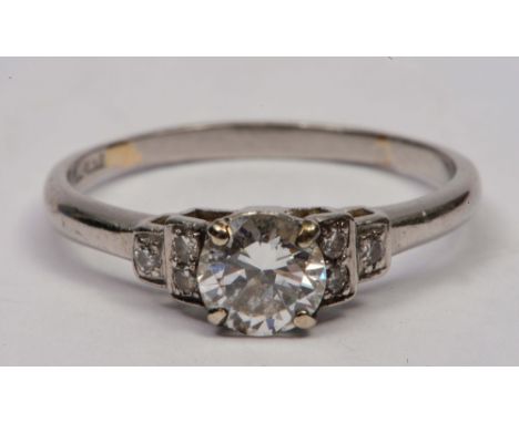 Platinum ring set with central diamond approximately .5 of a carat, set with diamonds to shoulders