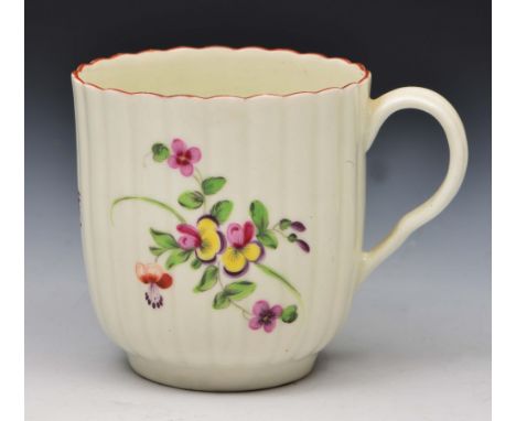 Worcester coffee cup circa 1770, decorated in polychrome enamels with European flowers and an insect, with fluted body and in