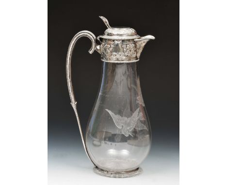 Glass claret decanter of bulbous form with engraved bird decoration, with silver mounted neck, lid and handle with embossed a