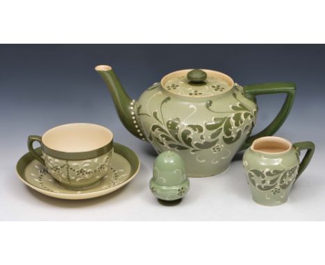 Attributed to Harold Barnard Teapot, milk jug, cup and saucer and salt, made for James Macintyre & Co, decorated in a green f