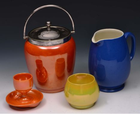 Four pieces of Moorcroft lustre ware to include an orange jar with plated handle and lid, an orange egg cup, a lime green squ