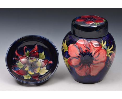 Moorcroft small ginger jar and bowl with floral design on a blue ground, with impressed factory marks, ginger jar 11cm high
