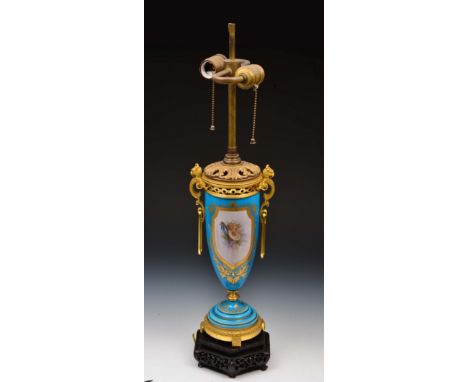 French probably Sevres bleu celeste lamp circa 1870 with ormolu mounts, painted reserve panels of putti and trophies, lamp an