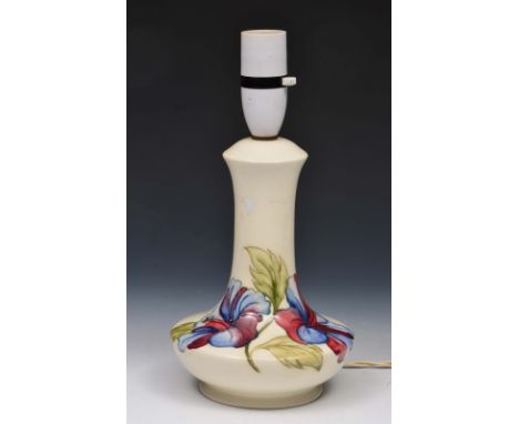 Moorcroft Hibiscus lamp base on a white ground, impressed manufacturer's stamp, 19cm high