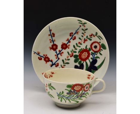 Worcester cup and saucer circa 1770, decorated in polychrome enamels with prunus and chrysanthemum sprays, with blue square m