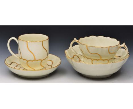 Worcester cup and saucer and a Worcester chocolate cup and saucer circa 1770, decorated in gilding with the Queen's pattern, 