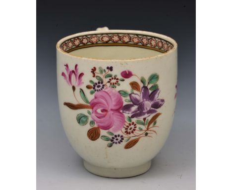 Worcester coffee cup circa 1770, decorated in polychrome enamels showing Oriental flowers, 6.5cm high