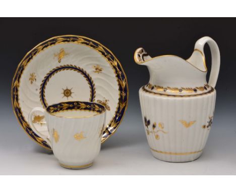 Worcester gilded cup and saucer and a Worcester gilded milk jug circa 1785-1790, each decorated in slightly different pattern
