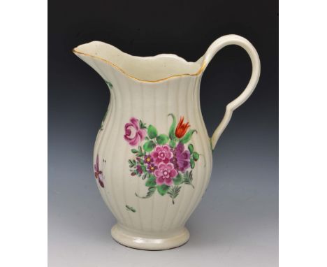 Worcester milk jug circa 1770, with ribbed body decorated in polychrome enamels with flowers and an insect, 12cm high