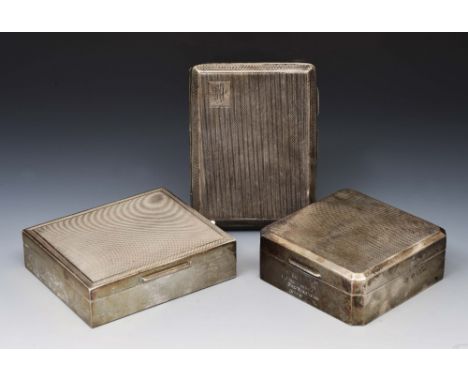 Silver cigarette case with engine turned decoration, 158 grams, together with two silver mounted cigarette boxes with engine 