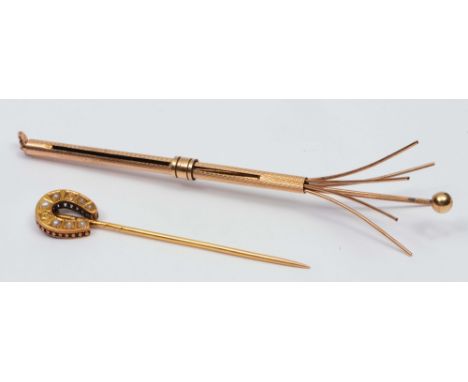 Victorian stick pin with horseshoe shaped finial with seed pearl setting, together with a 9ct gold twizzle stick with engine 