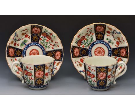 Two pairs of Worcester tea cups and saucers circa 1770, each decorated in the Imari pattern