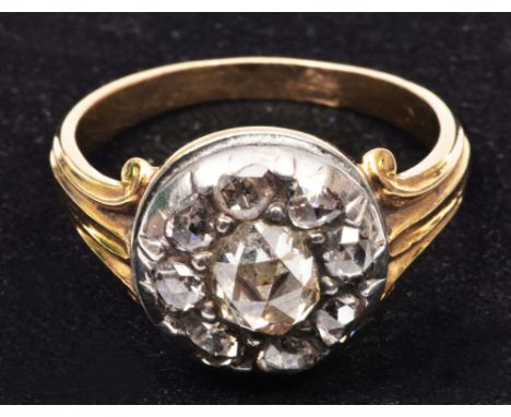 Georgian ring unmarked shank, set with central old cut diamond surrounded by eight further old white diamonds