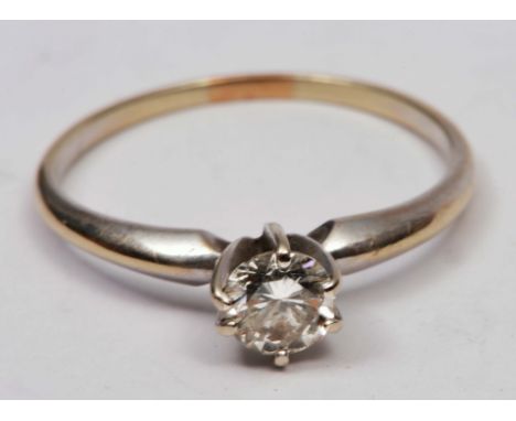 Unmarked ring with solitaire diamond setting