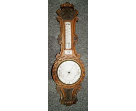 Edwardian oak framed aneroid barometer with enamel dial and incorporated thermometer