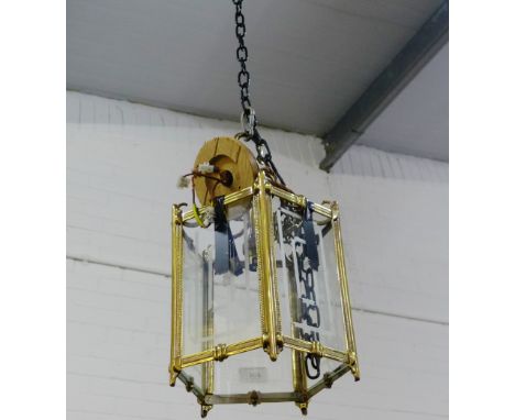 A brass and glass panelled hall lantern light