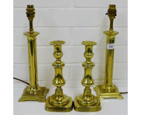 A pair of brass table lamp bases, together with a pair of knop stemmed brass candlesticks, (4) 