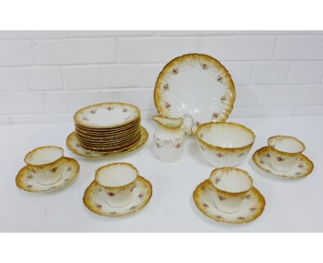 A Royal Albert crown china teaset, comprising twelve cups, twelve saucers, twelve side plates, cream jug, sugar bowl and two 